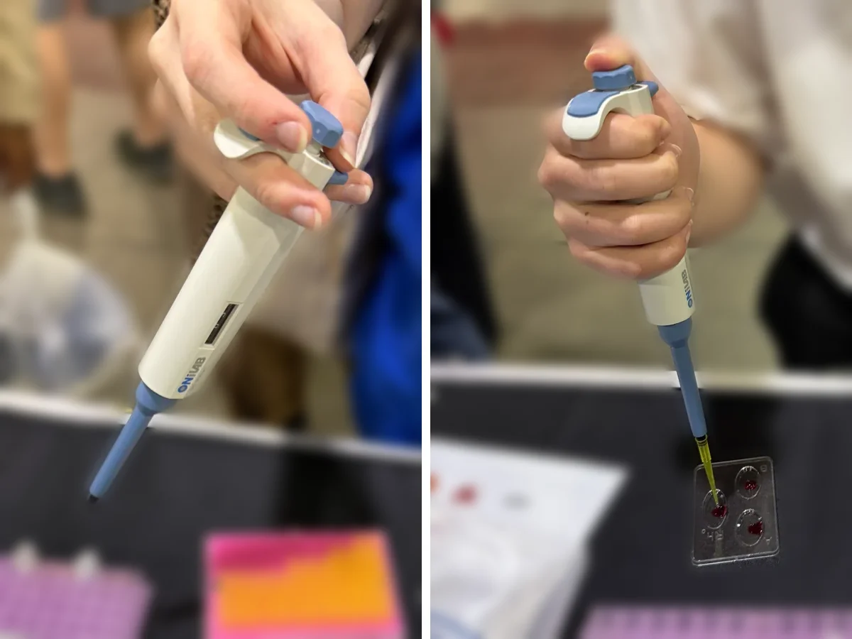 Two SkillsUSA participants using a micropipette at the bench after the VR session